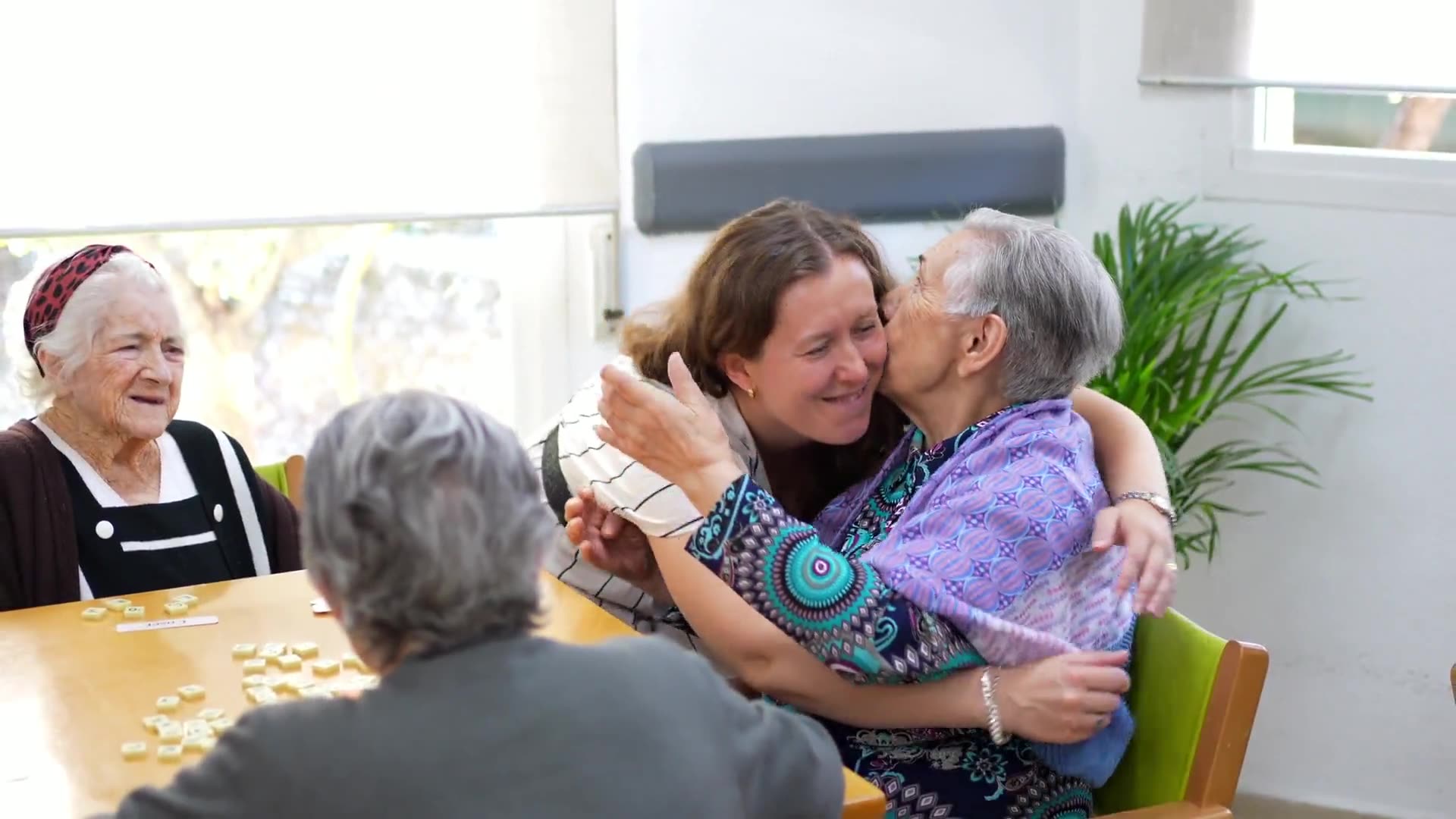 Members greeting each other, walking together, and applauding.